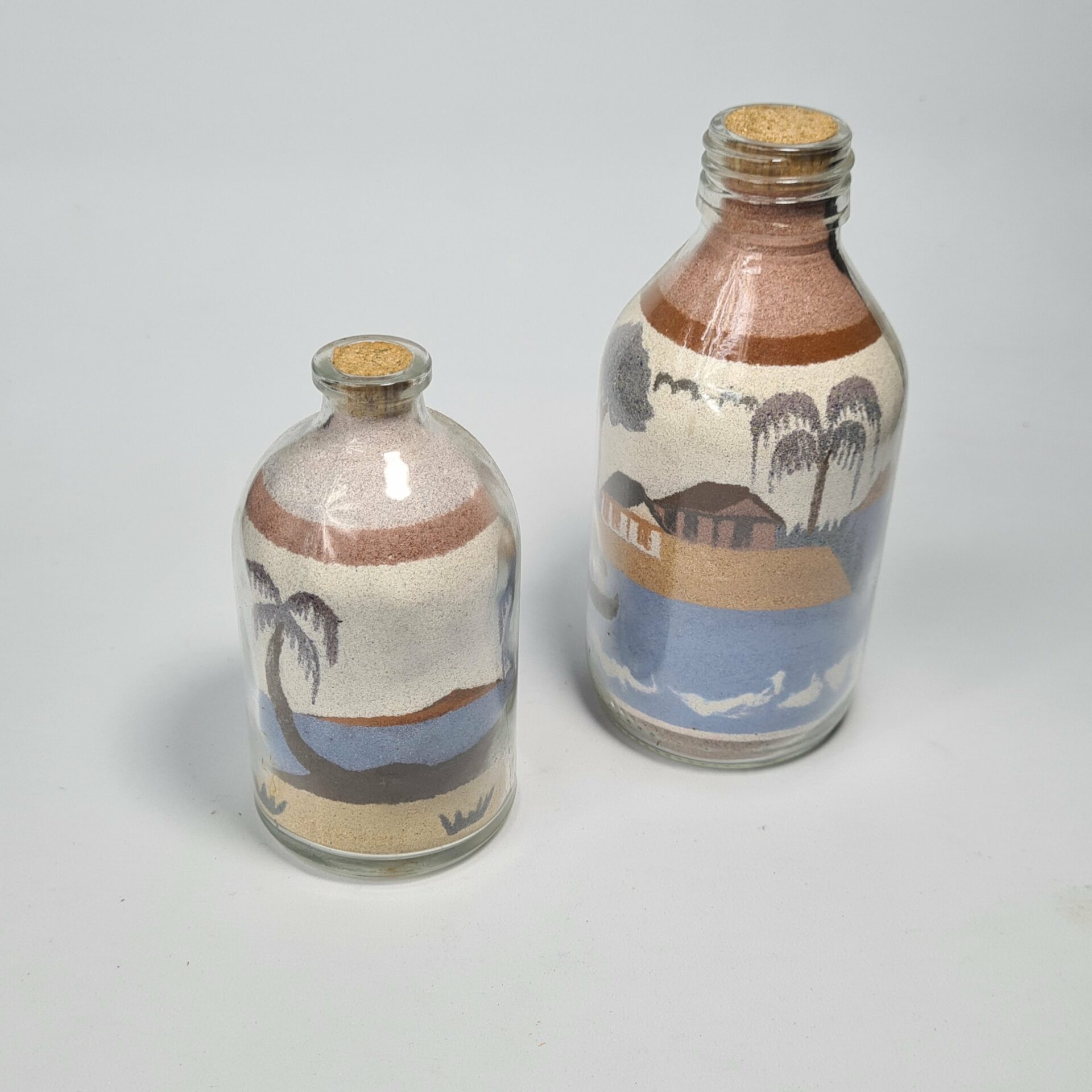 Dessin sur sable fin en bouteille